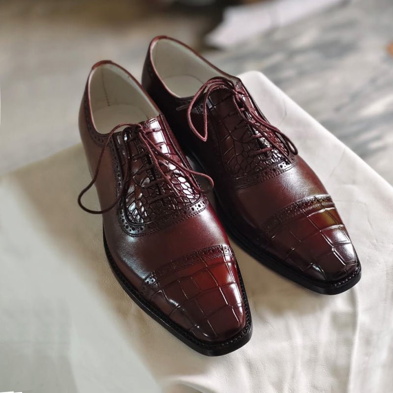 Handmade men’s burgundy crocodile embossed leather Oxford dress shoes with cap toe and lace-up design front view