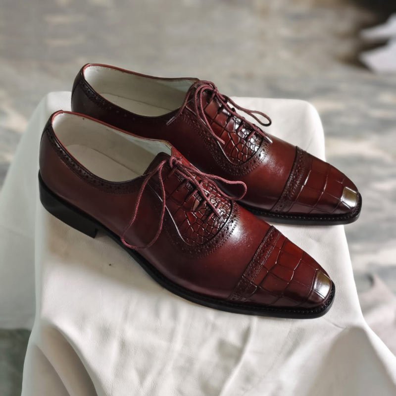 Handmade men’s burgundy crocodile embossed leather Oxford dress shoes with cap toe and lace-up design side view